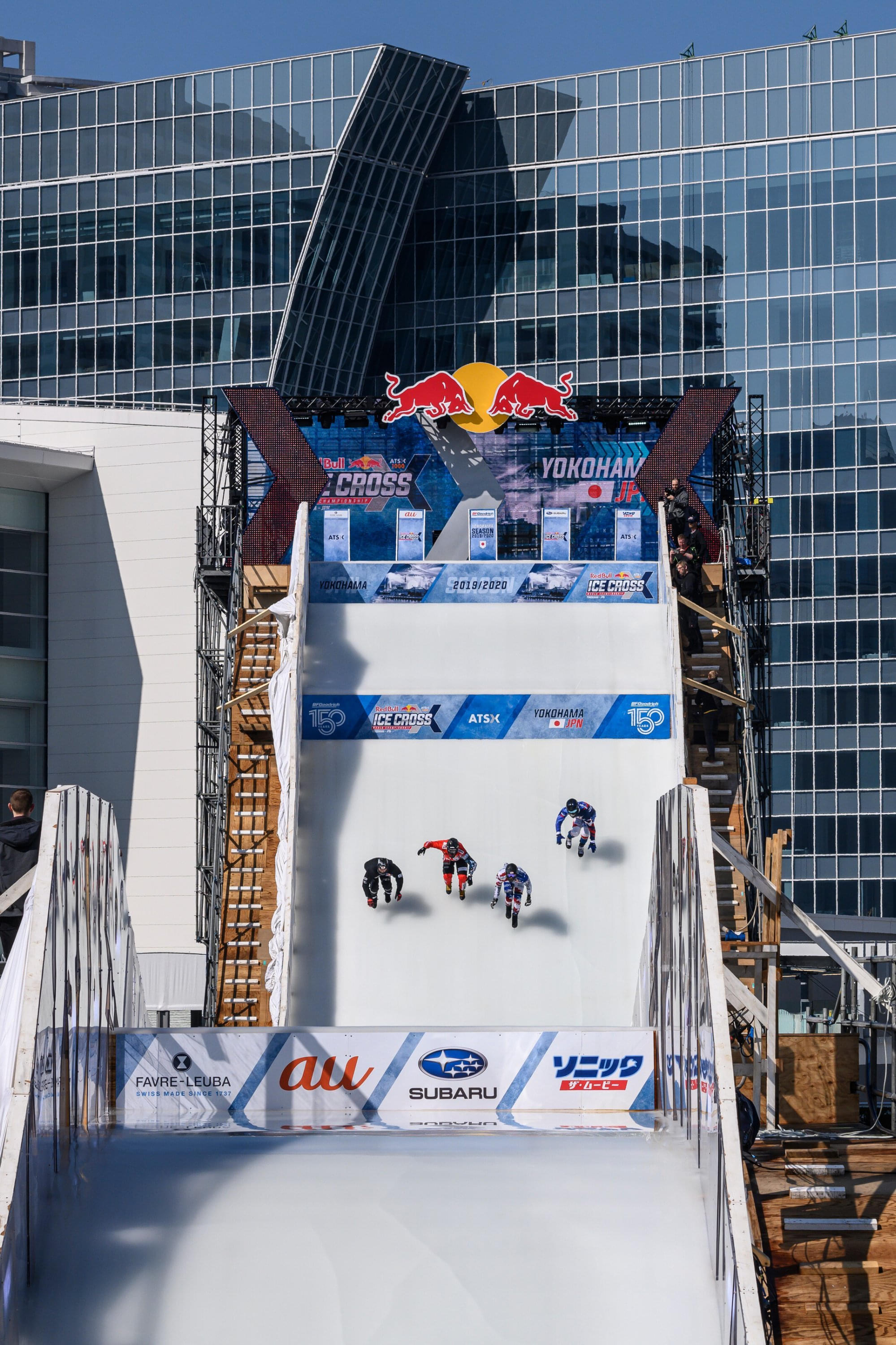Riders drop in to the steep starting straight heading to the Reiwa Booster. Image: Joerg Mitter / Red Bull Content Pool